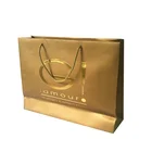 Spot uv logo golden card drawstring paper packaging bag custom shopping bag manufacturer