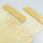 無料サンプル未処理の 100% 生のインドの毛、自然な絹のようなキューティクル同盟テープバージン毛延長人間