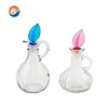 Hot selling glass oil bottle with handle /embossing glass oil bottle