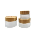 Wooden cosmetic packaging empty glass jar with bamboo top, clear frosted glass jar bamboo cosmetic cream containers
