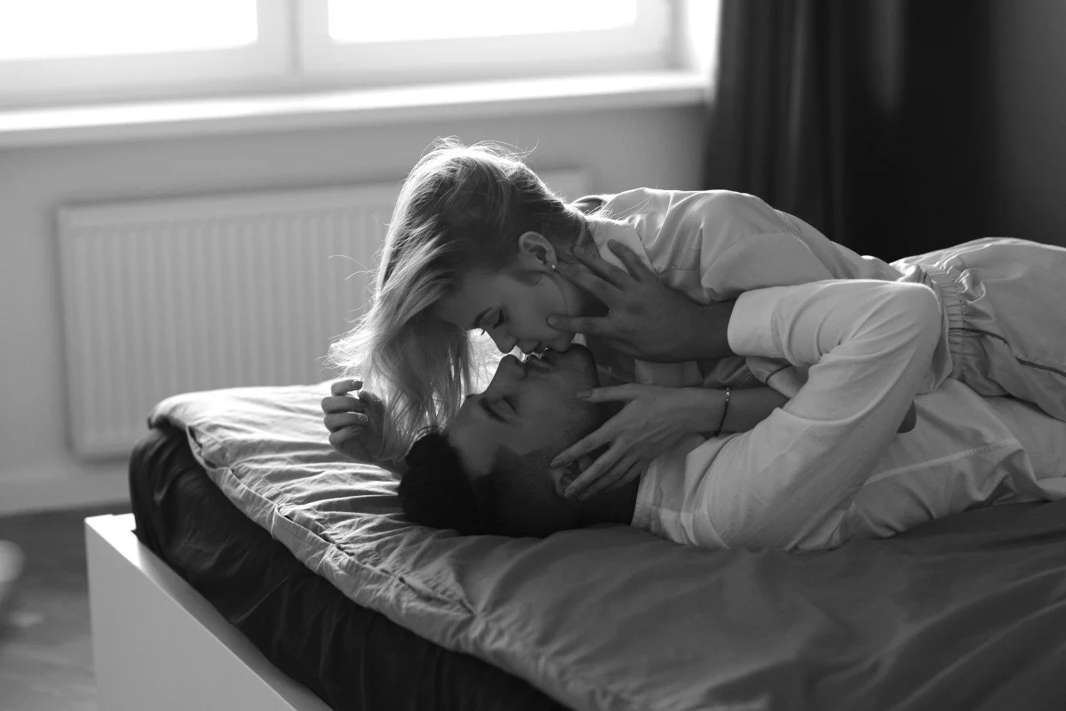 Couple kissing bed
