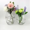 /product-detail/wholesale-clear-round-shape-mouthblown-wedding-decorative-transparent-round-glass-vase-62253209575.html