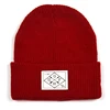 /product-detail/oem-sport-custom-woven-logo-winter-knitted-hat-merino-wool-beanie-hats-60816895958.html