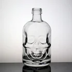 Cheap Good Quality Embossed Glass Bottle Glass Skull Face Bottle For Liquor