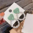 Fashion ear jewelry silver needle fluorescent love heart heart pearl hollow earrings wholesale