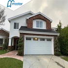 Residential sectional overhead garage door, orange with wide line garage door panel