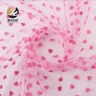 China manufacturer high quality fancy design pink soft tulle heart flocked mesh fabric for dress