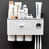 /product-detail/2019-new-trend-automatic-toothpaste-squeezer-dispenser-plastic-bathroom-wall-mounted-toothbrush-holder-set-62331153907.html