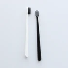 China toothbrush companies black white print logo bamboo charcoal toothbrush for adult