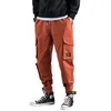 printing pattern orange color loose fit mens cargo pants with side pockets and rope China professional garment factory