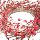 The red pip artificial berry wreath on the branch base of the manufacturer Christmas decorative wreath
