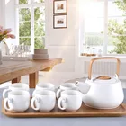 Hot selling wooden handle teapot white porcelain tea set with bamboo tray