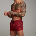 Wholesale fashion casual mens gym running track side zip pockets beach shorts with drawstring