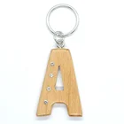 OEM handmade fashionable laser cut personalized custom initial english name A wooden diamond keychain