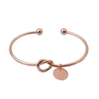Rose gold metal knot with engraved letter coin bangle bracelet