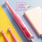 Children teeth cleaning battery operated toothbrush toothbrush with 2 brush heads