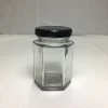 /product-detail/cheap-120ml-hexagon-fancy-glass-honey-storage-jars-with-black-metal-cap-for-honey-jam-62347132813.html