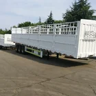 3 axle grid fence semi trailer transporting animal