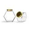 /product-detail/wholesale-hexagon-shaped-glass-empty-honey-jar-with-screw-cap-60808705232.html