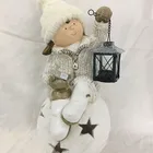 Christmas figure girl sitting on ball girl with led light
