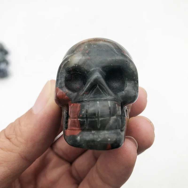 african blood stone carved with small skulls healing crystal