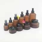 Cosmetic bottle packaging 30ml 60ml empty glass lotion bottle 2oz frosted amber glass bottle with black aluminum pump