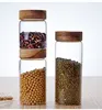 /product-detail/high-borosilicate-hand-made-leaf-free-food-kitchen-glass-storage-jar-with-wooden-lid-62072210820.html