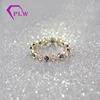 Bezel setting solid 14k yellow gold ring with 2.5mm synthetic sapphire and round melee moissanite