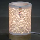 Unique design hollow out home decor handicraft hotel used modern wholesale electric ceramic diffuser for aroma