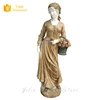 The Beautiful Stone Girl Statue With Carrying A Basket Of Flowers