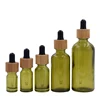 eco friendly cosmetic containers 15ml 20ml 30ml 50ml 100ml serum dropper bottle green glass pipette bottle with bamboo dropper