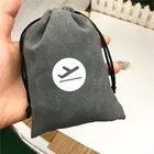 Grey faux suede jewelry drawstring pouch with white logo