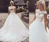 ZH2022Q 2019 Bateau neck Lace Appliques Ball Gown Wedding Dresses cap sleeve Sheer lace-up back with bow Court Train Bridal Gown
