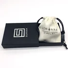 black paper packaging box with pull handler jewelry items custom print