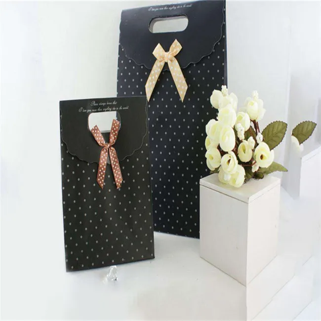 matte black paper gift bag with ribbon bow