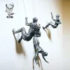 /product-detail/modern-metal-art-interior-decorative-wall-hanging-climbing-man-bronze-sculpture-for-sale-62049021807.html