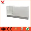 Modern white painted shop counter design for garment store with glass shelf