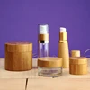 Eco-friendly custom made cosmetic packaging bamboo wooden cream jar, cheap popular durable cylinder empty bamboo pp plastic jar