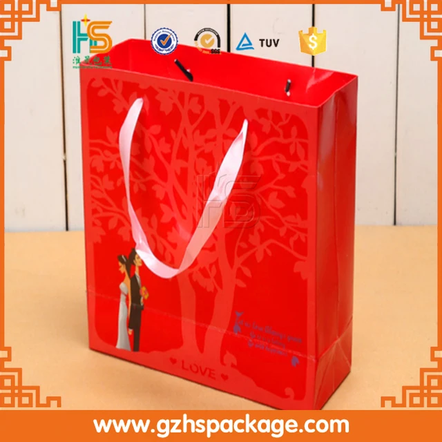 red coated paper bag with ribbon handle matt lamination gift bag