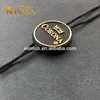 oem factory clothes brand logo plastic string gold seal tag for clothing