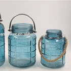 Small glass wind light candle holder with metal handle