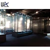 Underground Gun Shop Design Shop Equipment LED Spot Light Glass Display Wall Mount Shelf With Leather Chair