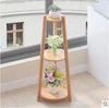 /product-detail/2-tier-round-corner-stand-wood-artificial-decorative-flower-plant-pot-rack-60785665760.html
