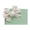 Burlap stretch loop with pre-tied ribbon bow to wrap onto box easily