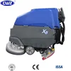 Battery operated hand held dual brush automatic floor scrubber