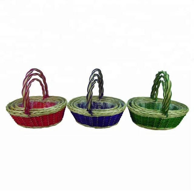 nested set of painted willow baskets with overhead handles