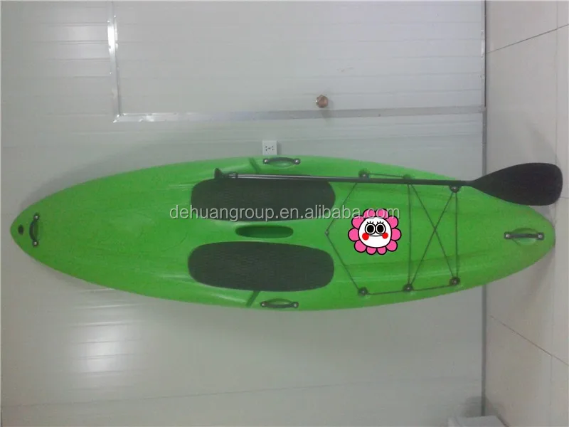 single green surf kayak