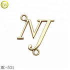 Gold color clothing metal label sewing letter accessories tag by guangzhou factory