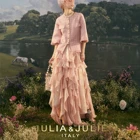 An irregularly layered skirt with wavy pink hem Pink skirt Pink ruffled skirt