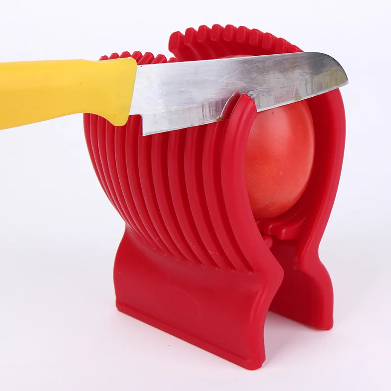 Cut the tomato slices of tomato salad for artifact tomato fruit vegetable slicer creative kitchen slicer